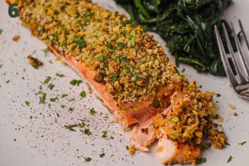 Pistachio crusted salmon on a plate.