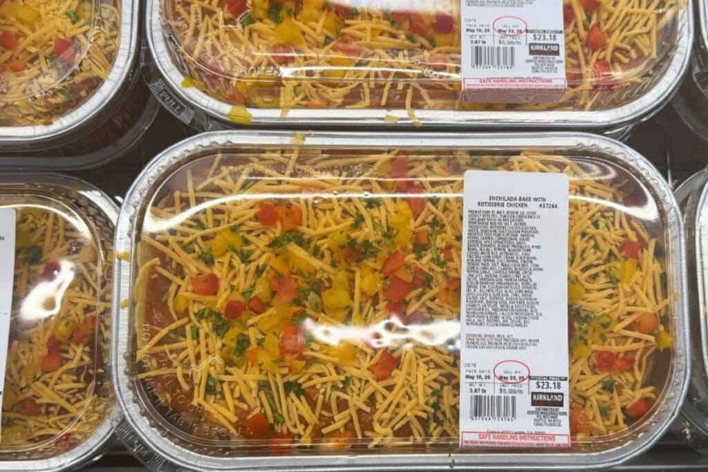 Premade food in containers displayed in a store.