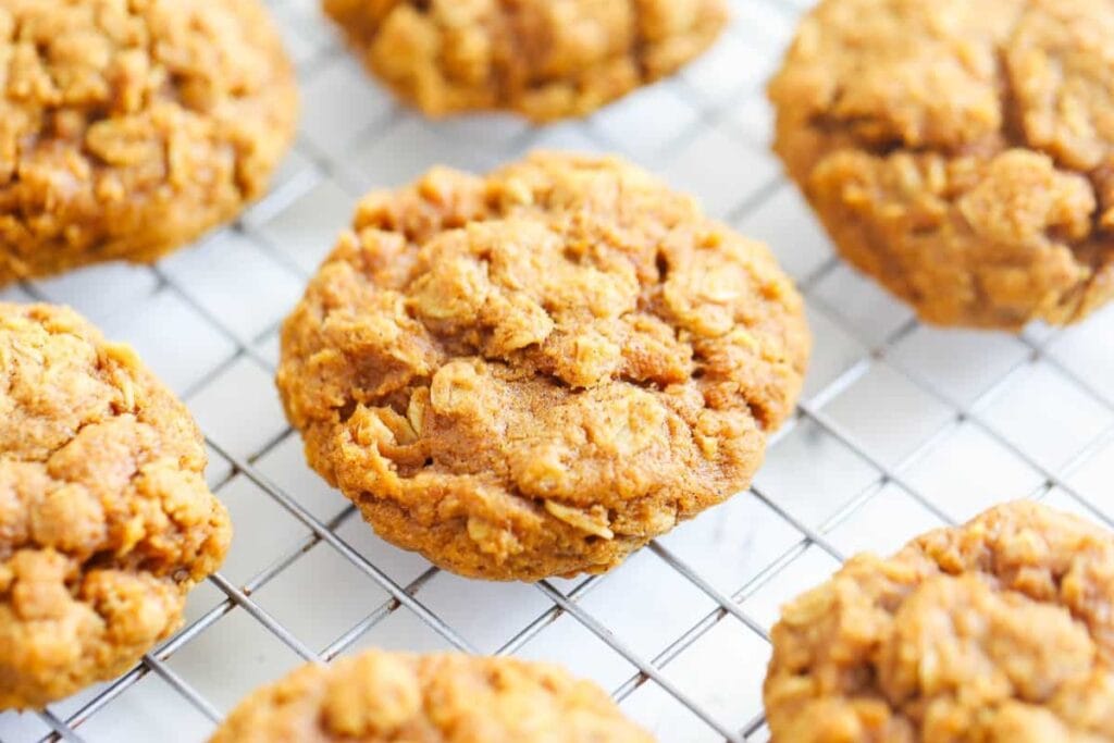 Pumpkin oatmeal cookies on a cooling rack.