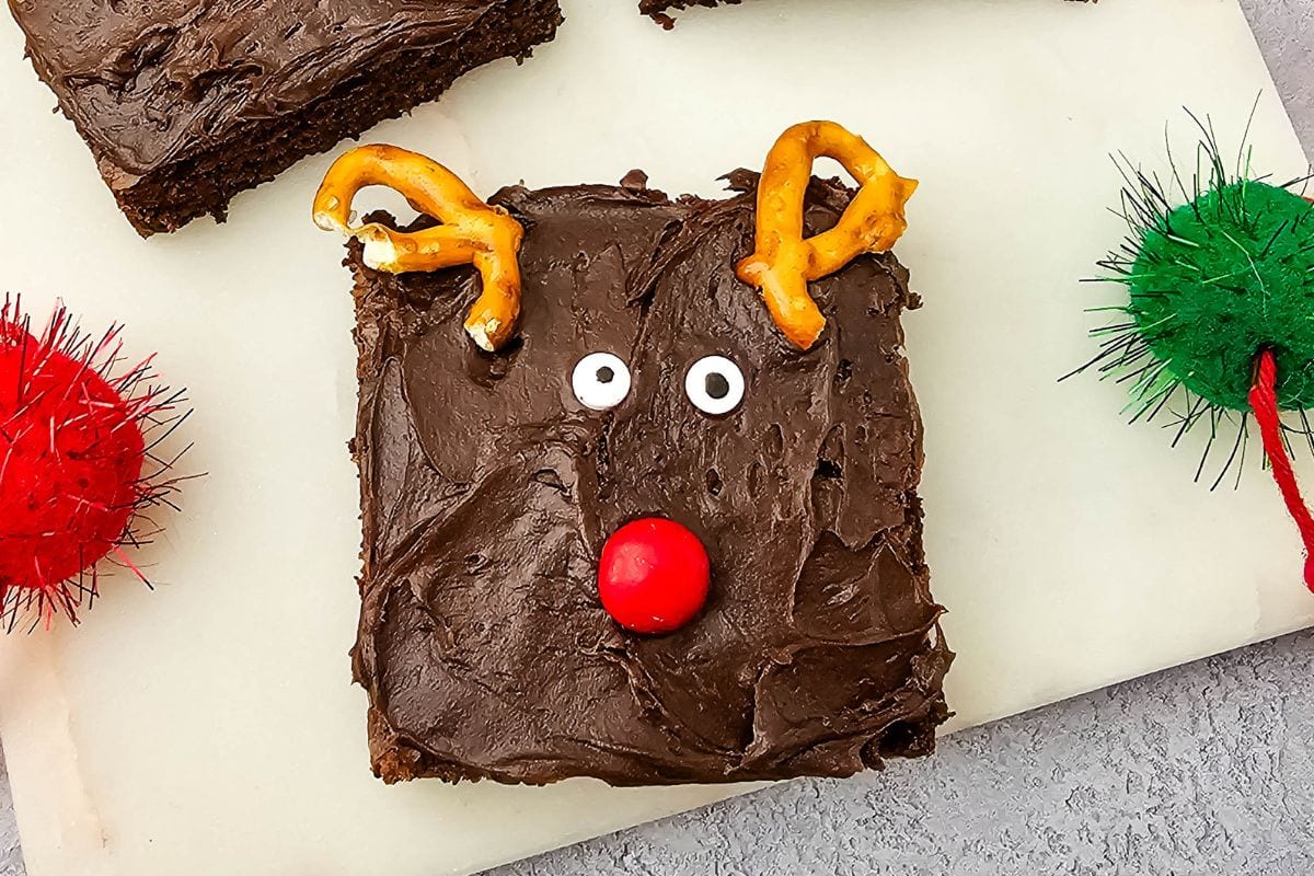 Reindeer brownies on a white cutting board.