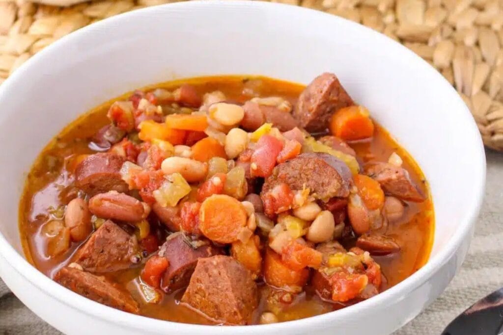 Slow cooker cajun bean soup in a white bowl.