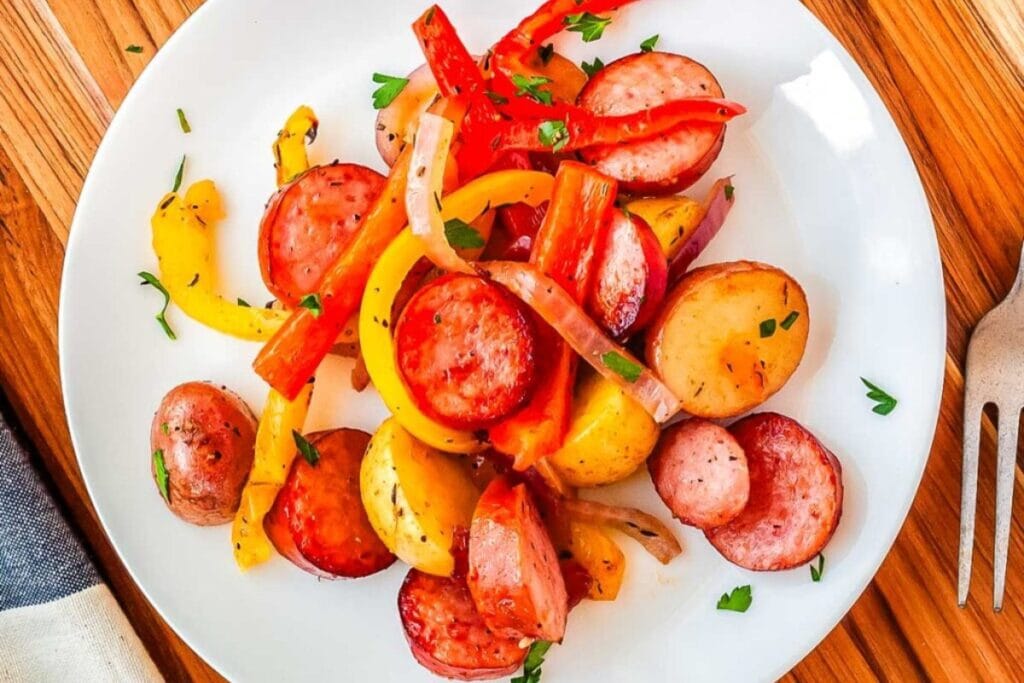 Smoked sausage and potatoes on a plate.