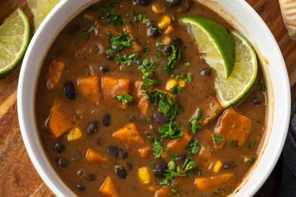 Southwest black bean sweet potato soup in a white bowl.