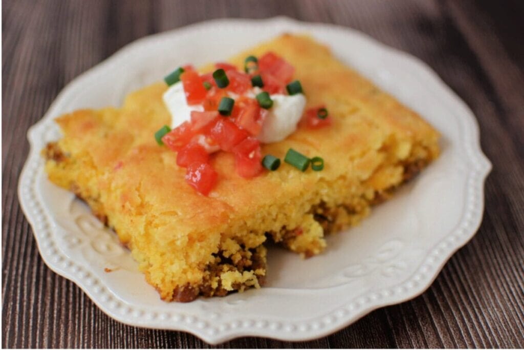 Taco cornbread bake served on a white plate.