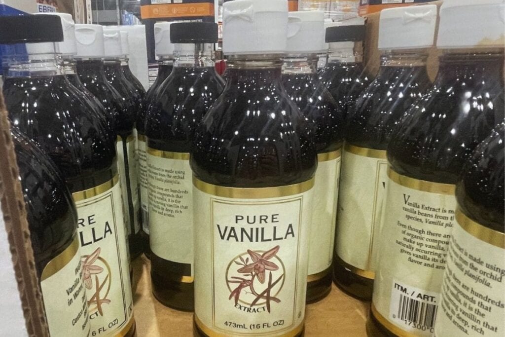 Bottle of vanilla extract on a shelf.