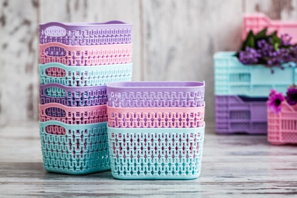 Pastel plastic baskets for small household storage.