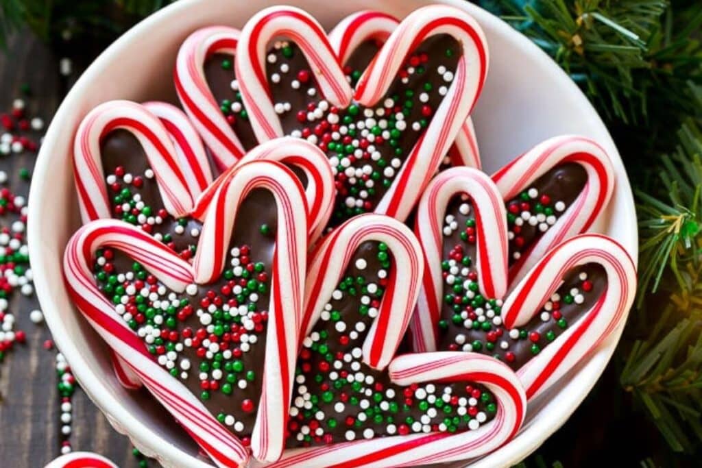 A close up shot of candy cane hearts.