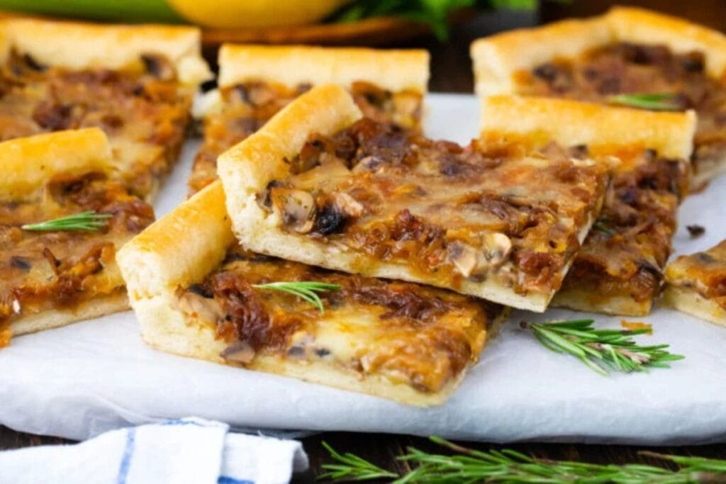 Caramelized onion tart with mushrooms and rosemary.