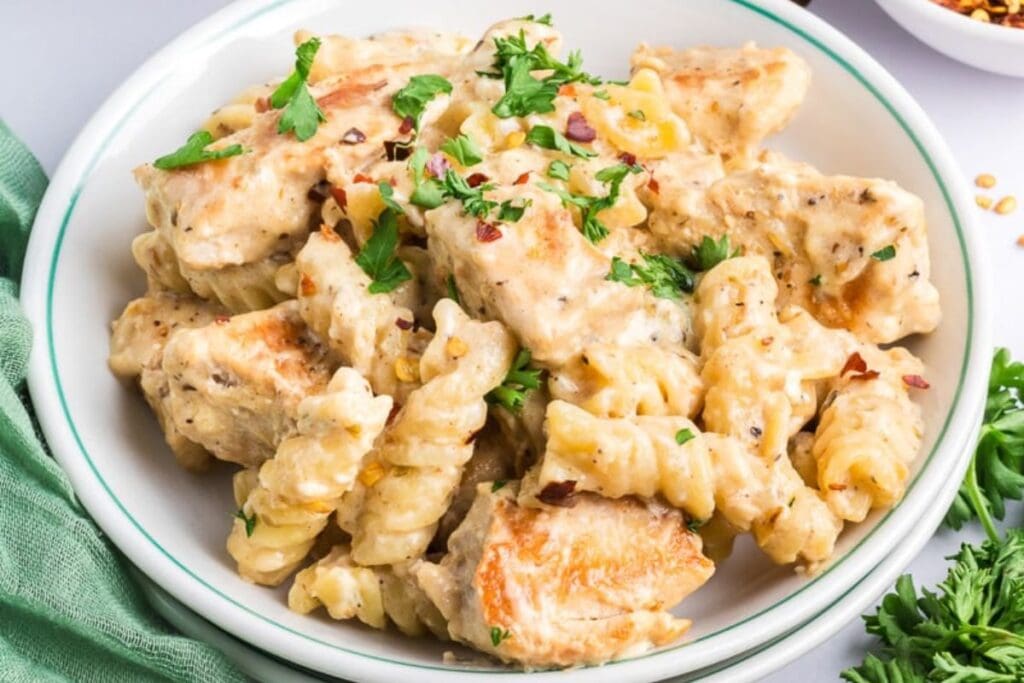 A close up shot of chicken parmesan pasta.