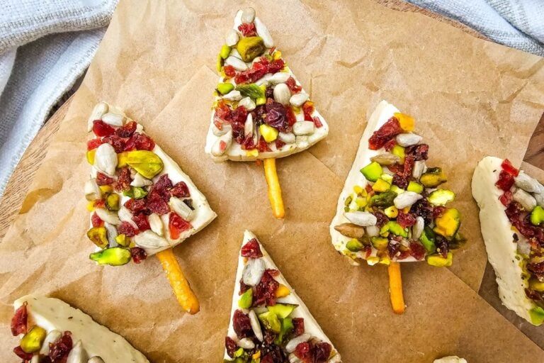 Christmas cheese trees on a parchment paper.
