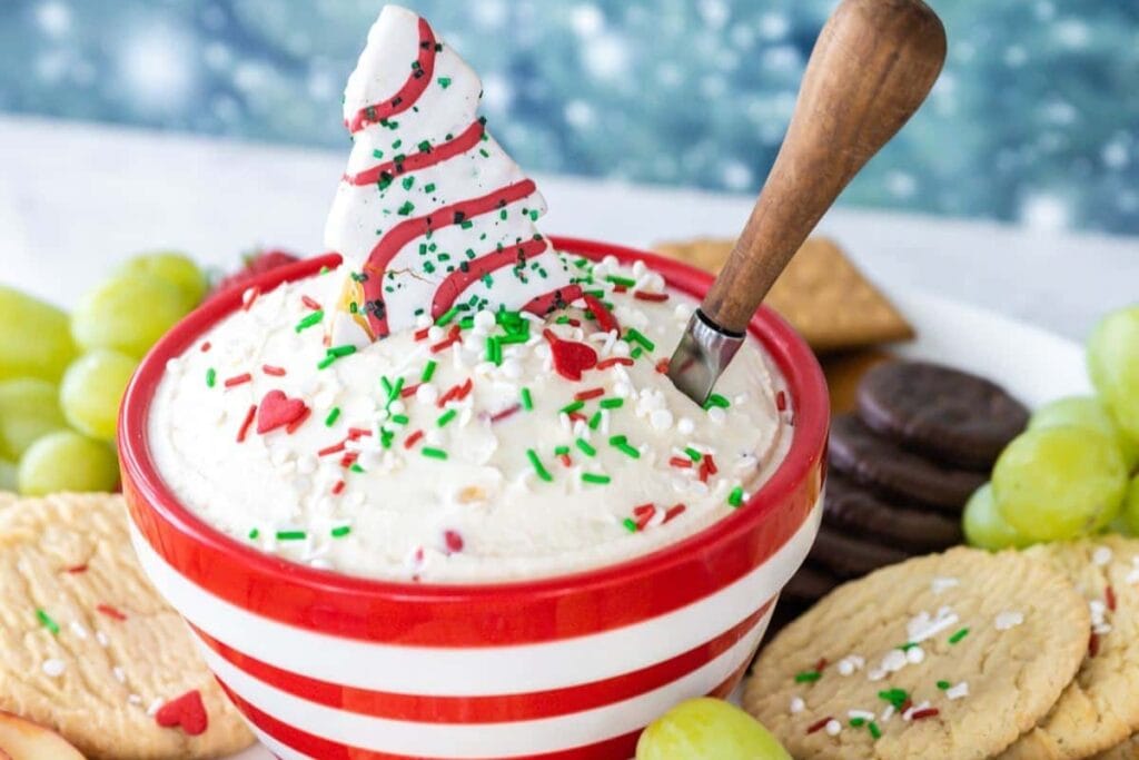 Christmas dip with a tree cookie and red and green sprinkles.