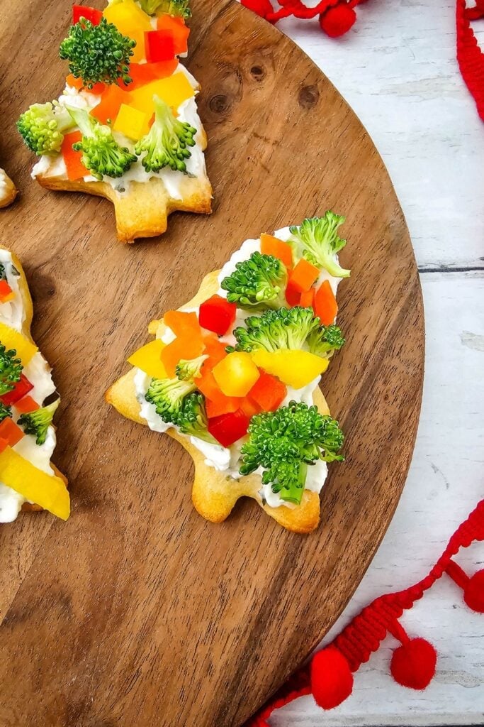 A close p shot of Christmas tree pizzas.