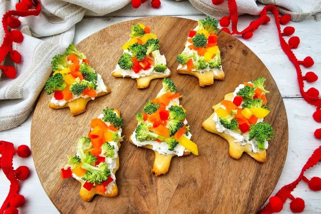 A close p shot of Christmas tree pizzas.