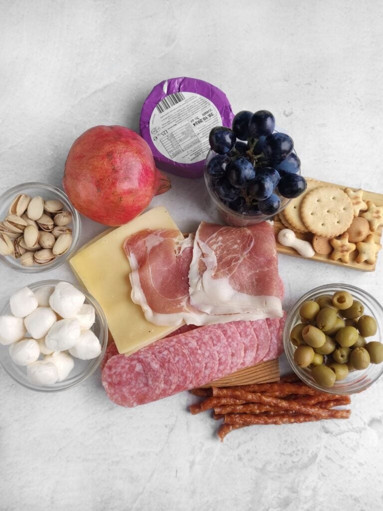 Close up shot of Christmas wreath charcuterie board ingredients.