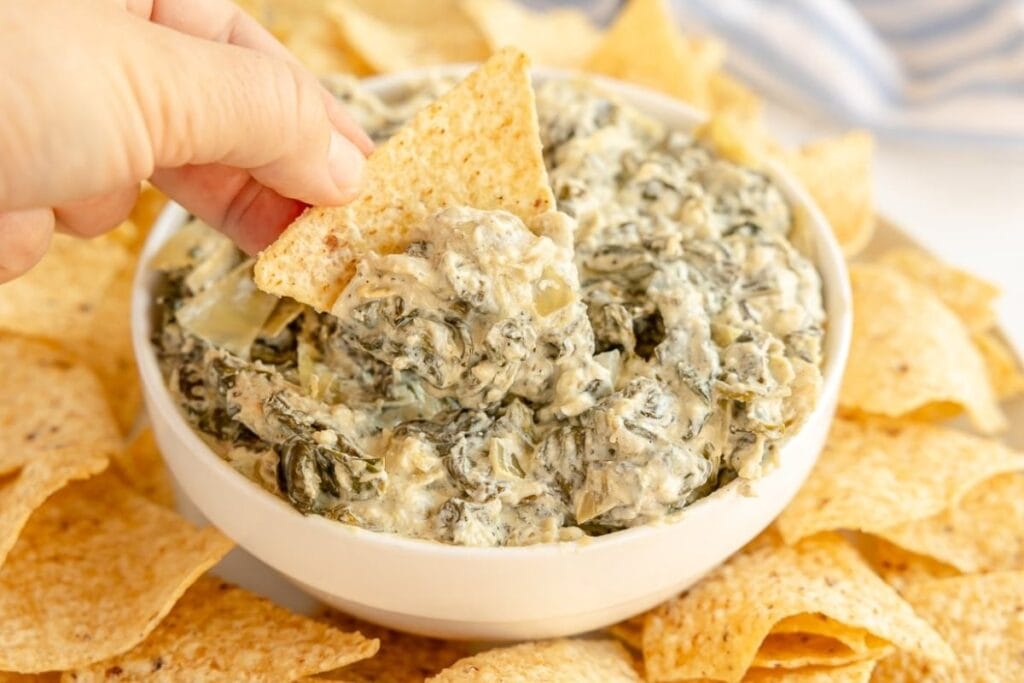 A close up shot of spinach artichoke dip.