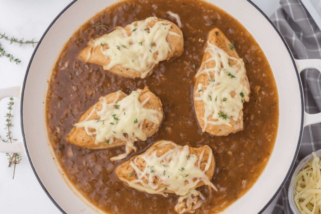 A close up shot of onion chicken skillet.