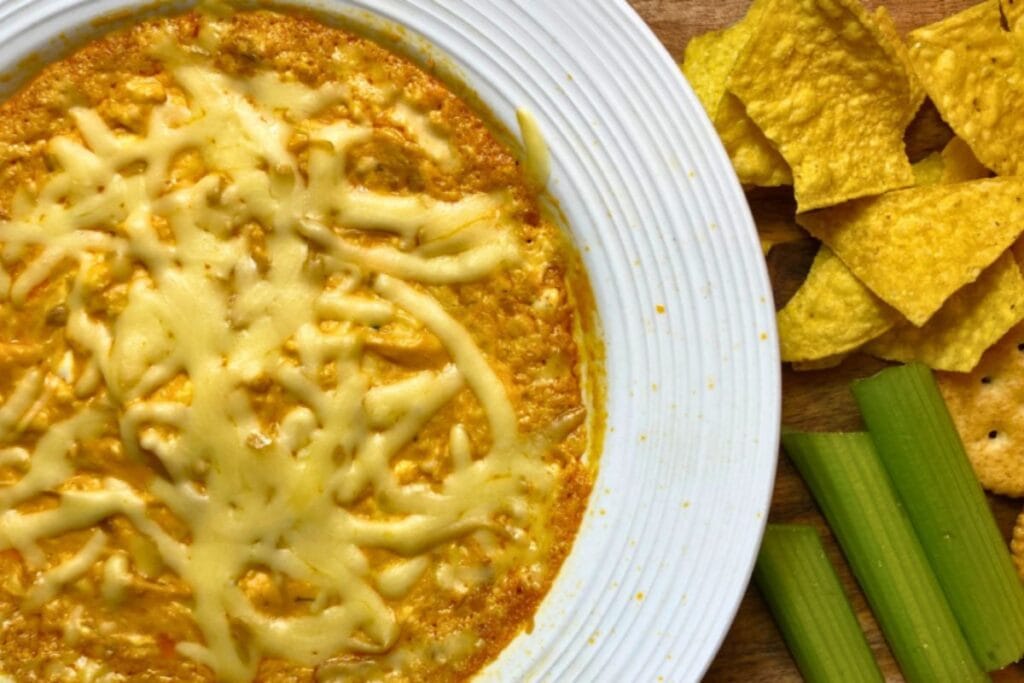 Buffalo cheese dip with gouda, served with tortilla chips and celery sticks.