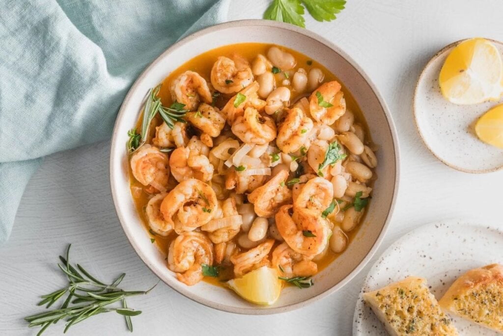 A close up shot of shrimp and bean stew.