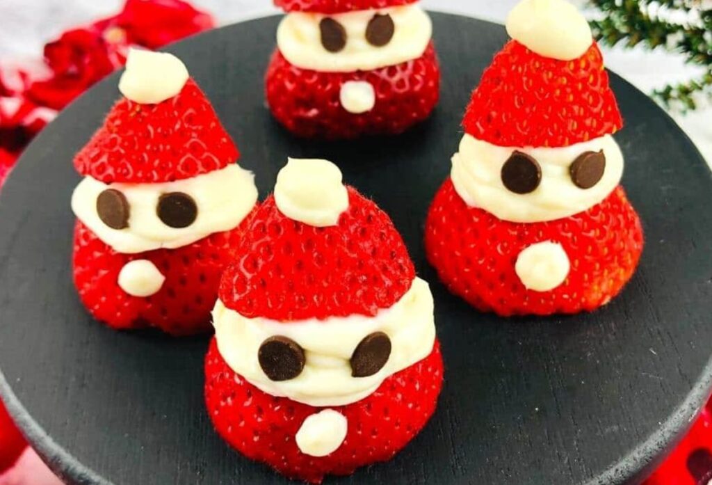 Santa strawberries with cream cheese and chocolate chip eyes.