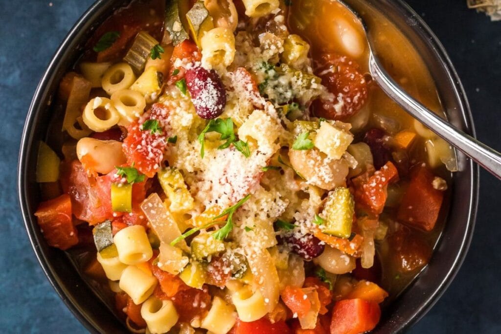 A close up shot of minestrone soup.