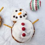 A close up shot of snowman cinnamon rolls.