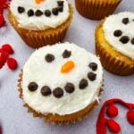 A close up shot of snowman cupcakes.