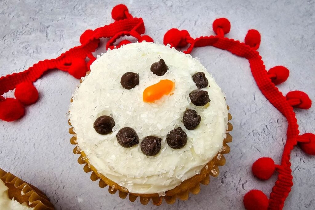 A close up shot of snowman cupcakes.
