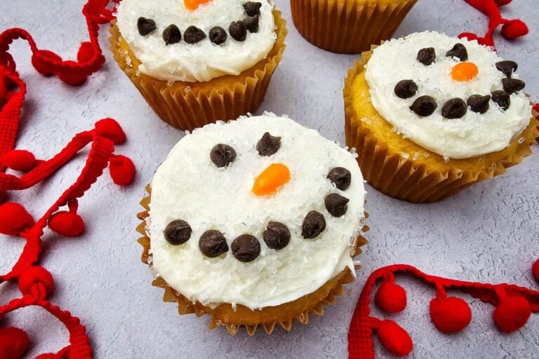 A close up shot of snowman cupcakes.