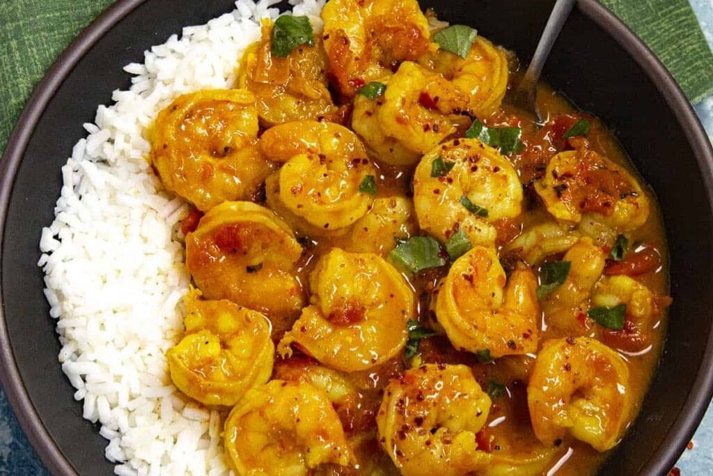 Close-up of Thai shrimp curry with rice.