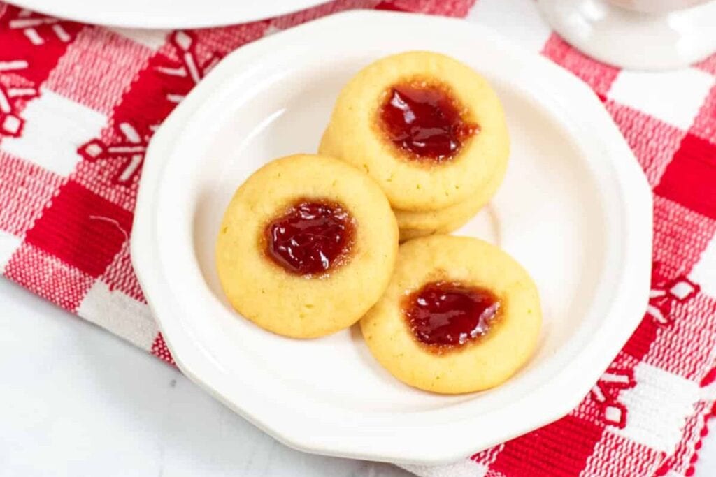 A close up shot of thumbprint cookies.