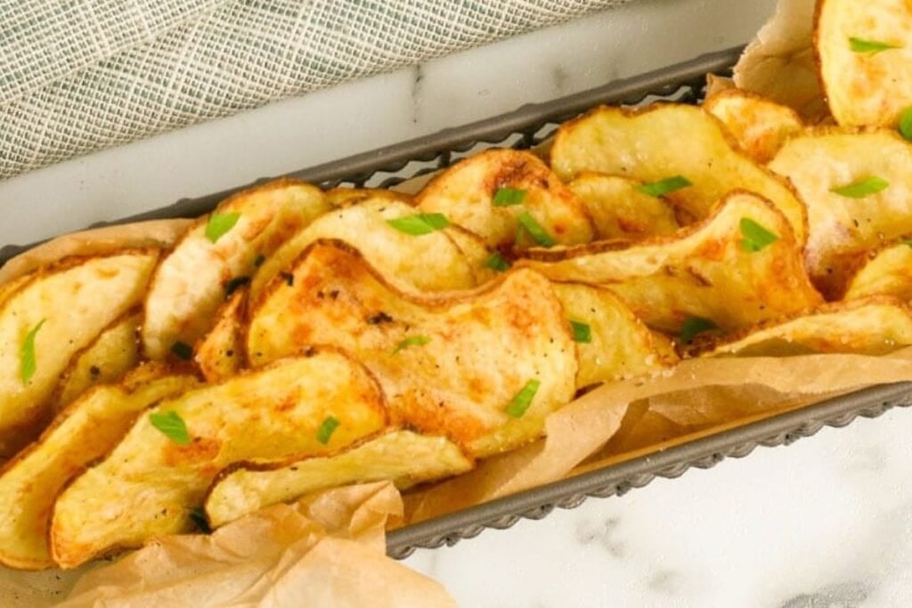 Air fryer potato chips on a tray.