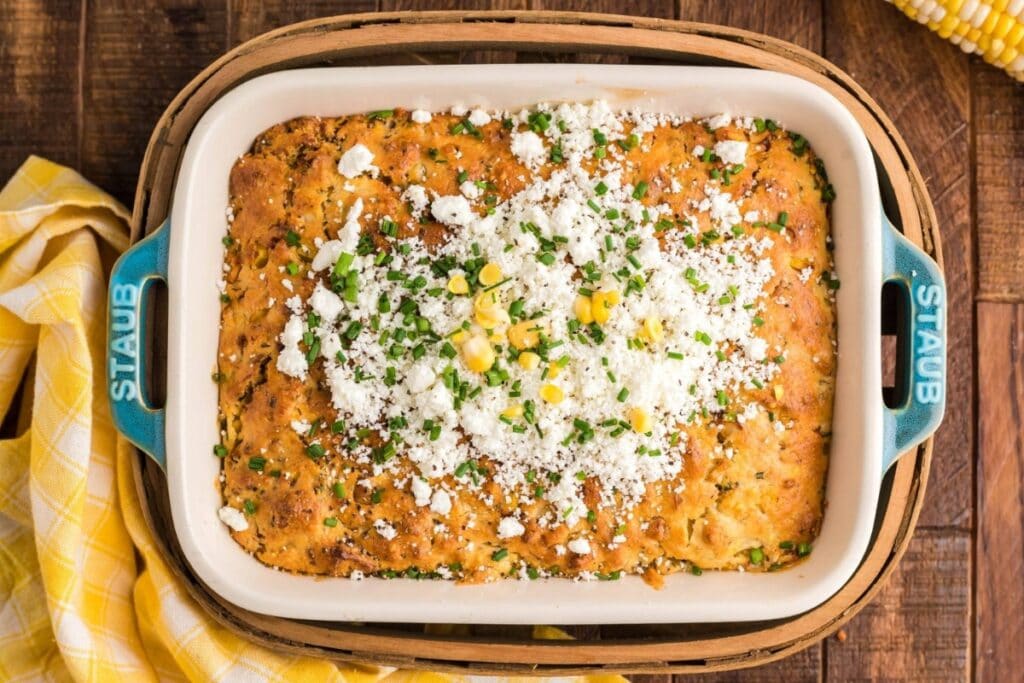 Bacon-loaded cornbread pudding in a baking dish.