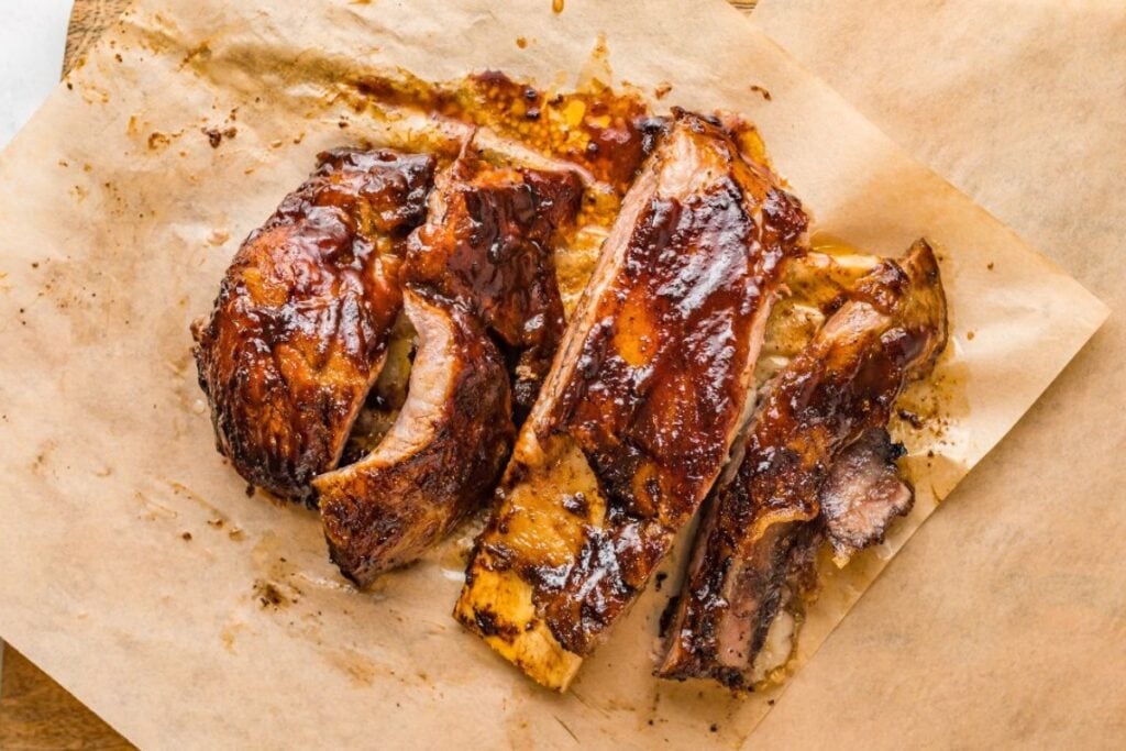 BBQ ribs on parchment paper.