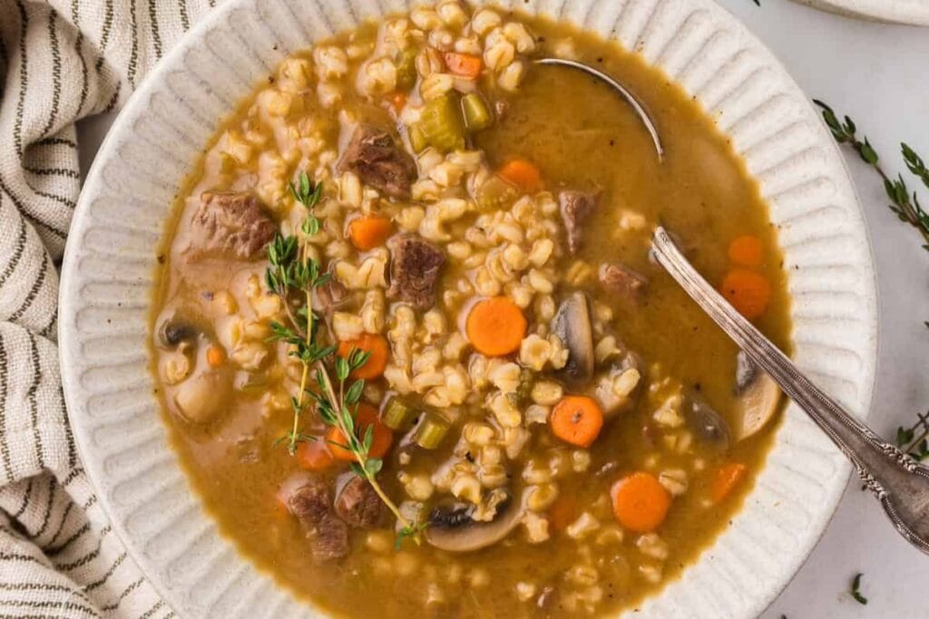 Beef barley soup in a bowl.