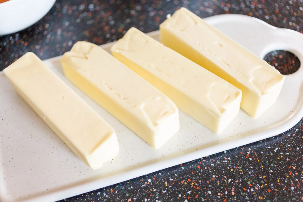 Butter sticks on plate.