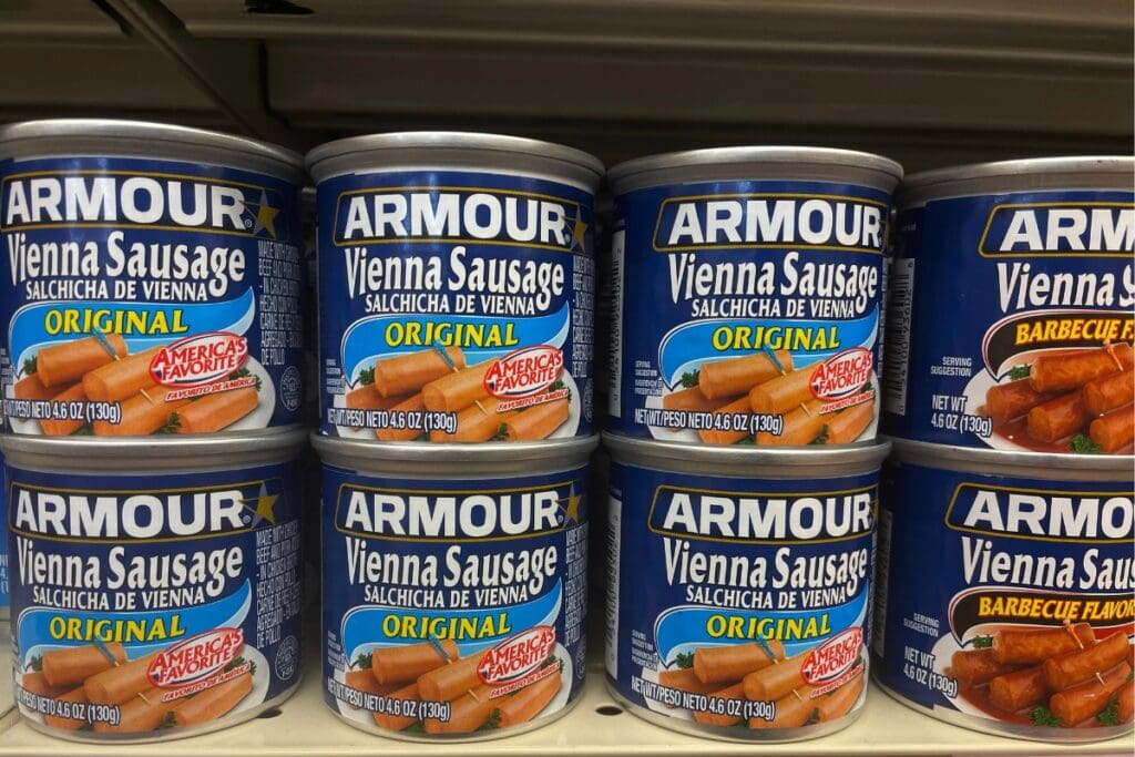 Canned Vienna sausage on store shelves.
