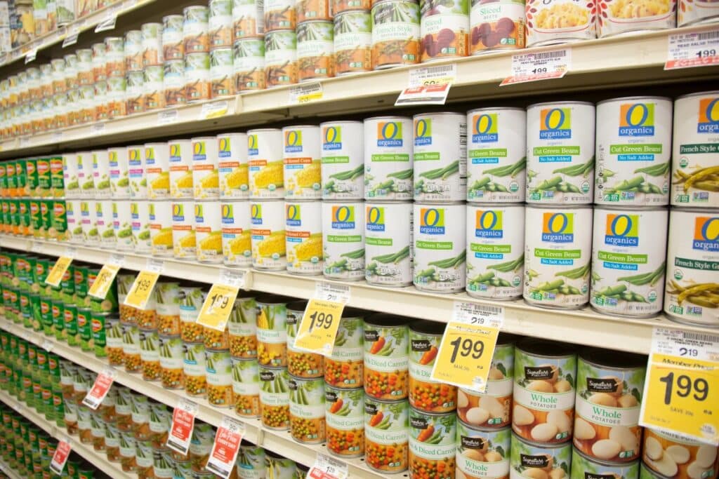 Canned veggies displayed on shelves.