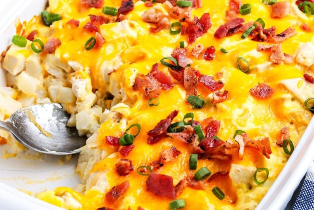 Close-up of chicken and potato casserole in a baking dish.