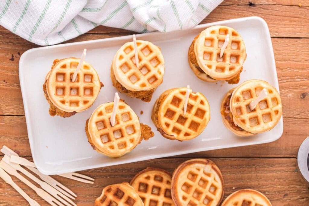 Chicken and waffle sliders on a plate.