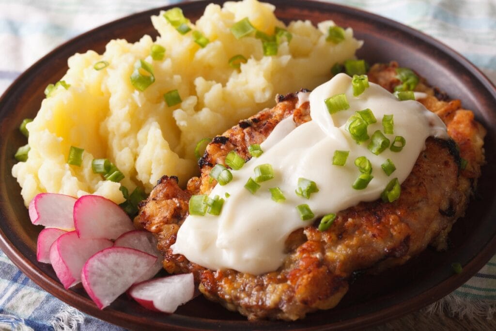 Crispy chicken fried steak on a plate.