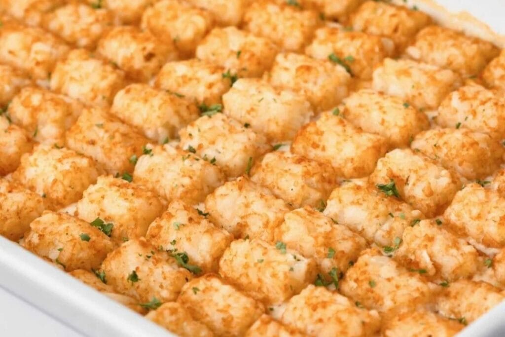 Close-up of chicken tater tot casserole in a baking dish.