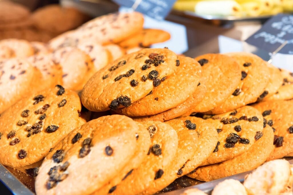 Assorted cookies on store tray.