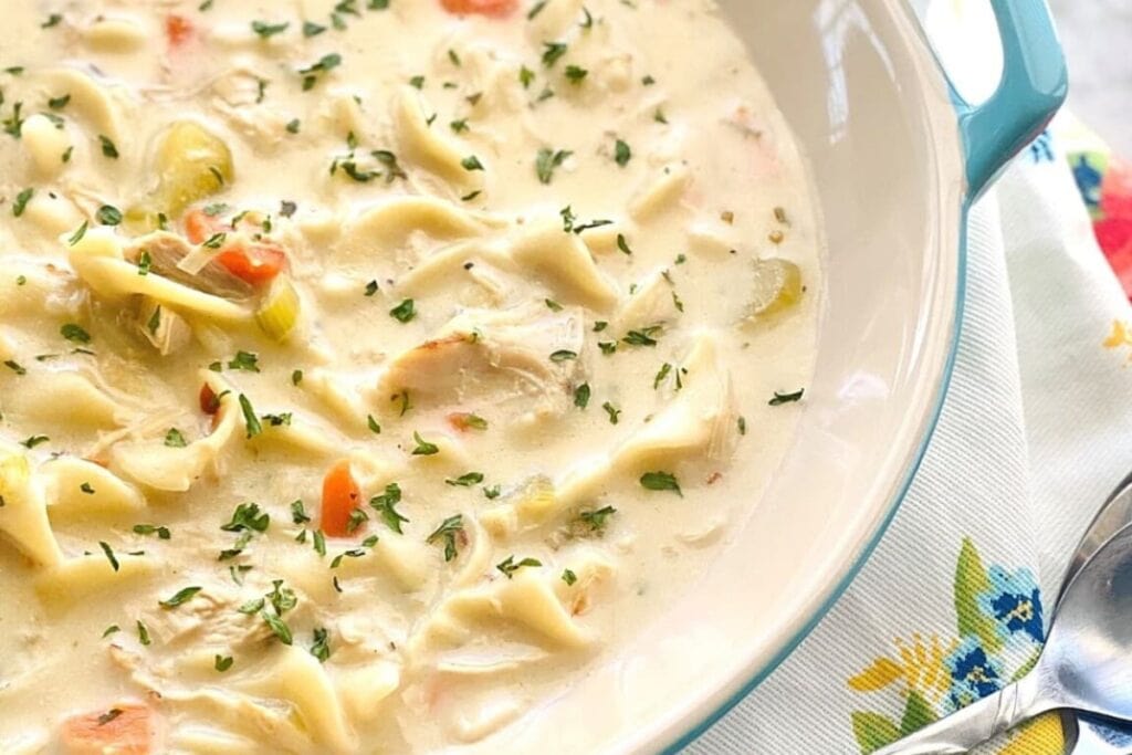 Creamy chicken noodle soup in a bowl.