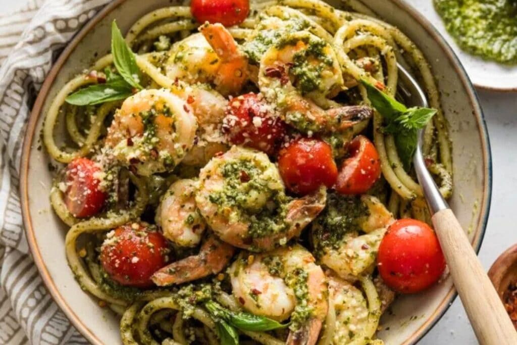 Creamy pesto shrimp on a plate.