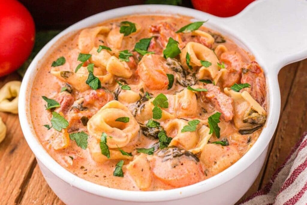 Creamy tortellini soup in a bowl.