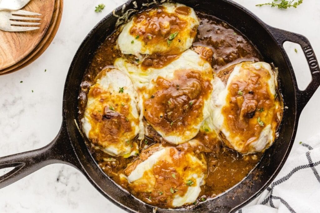 French onion pork chops in a skillet.