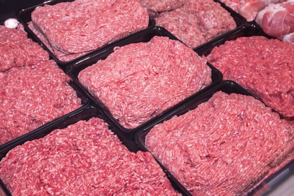 Ground meat in a tray on display.