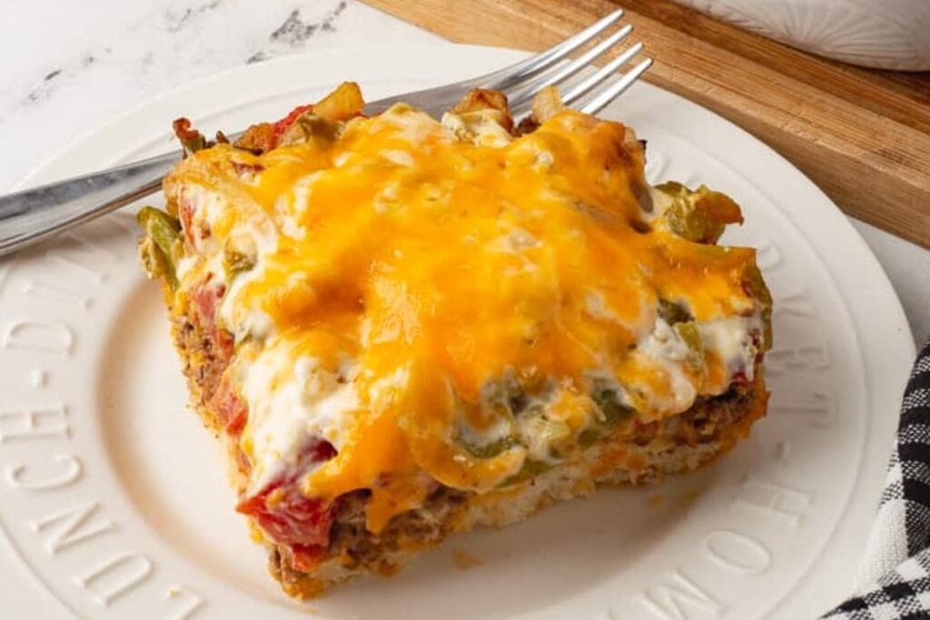 John Wayne casserole served on a plate with a fork on the side.