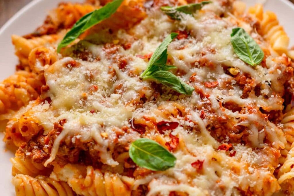 Lazy lasagna served on a plate with melted cheese on top.