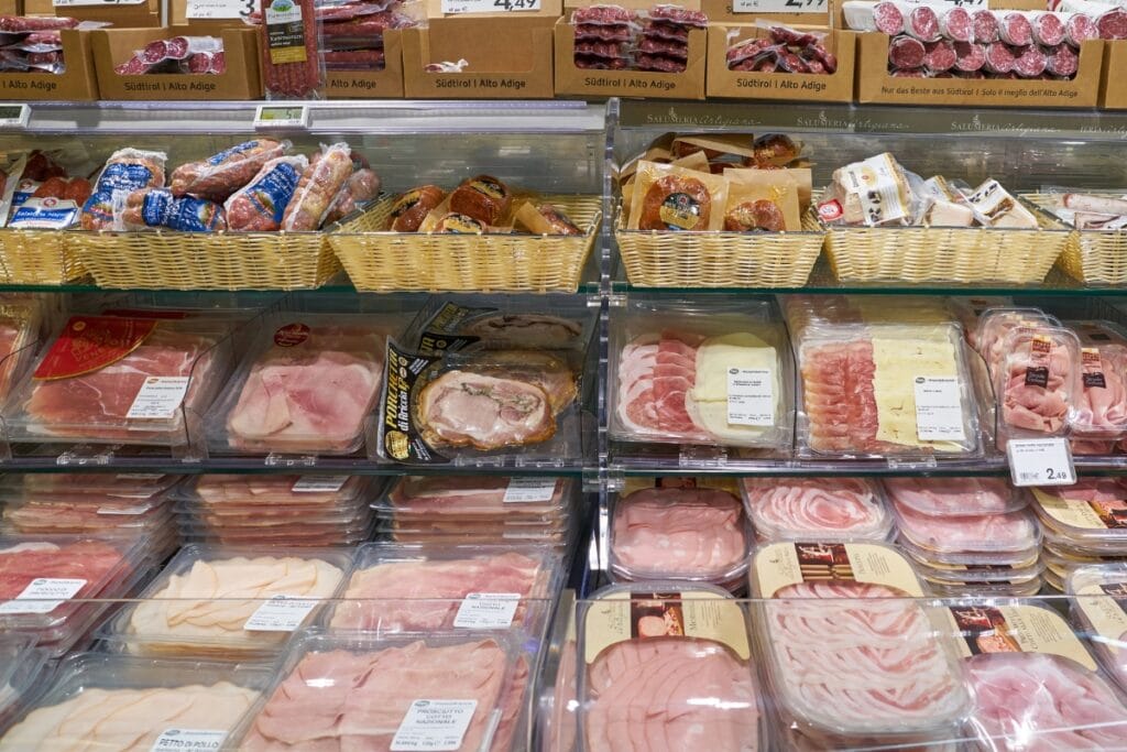 Various lunch meats on store shelves.